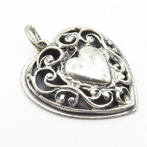 Beau sterling silver charm pendant